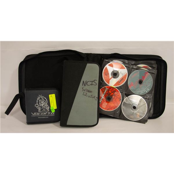 3 CASES WITH DVDS AND CDS