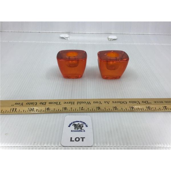PAIR OF ORANGE ART GLASS CANDLE HOLDERS