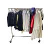 Image 1 : Rack of movie set clothing - Skirts / Collared shirts / Mechanic shirts / Gowns - Rack not included