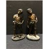 Image 1 : Group of 2 "young boy the whistler" statues (one has a broken arm)