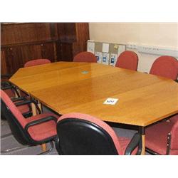 SECTIONAL MEETING TABLE, MATCHING CHAIRS, FLIP CHART, SCREEN ON WALL RAIL.