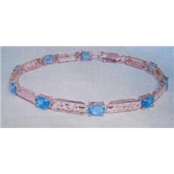 Blue Topaz Bracelet, 10K yellow gold- blue topaz are oval, faceted, approx. 5.00 carats, transparent