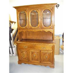 Kitchen hutch with 2 glass doors on upper half- etched -, 3 doors and 2 drawers on lower half, light