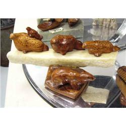 Group of 2 wood carved spotted seals- one has pup on back- and small bear on bone (2)