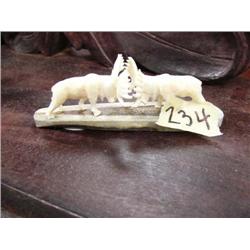 Pair of carved ivory fighting bull moose mounted on ivory- 1-1/4" tall, 4" long (2)