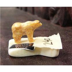Carved fossilized ivory bear mounted on white ivory- 3/4" tall, 1-1/4" long (2)