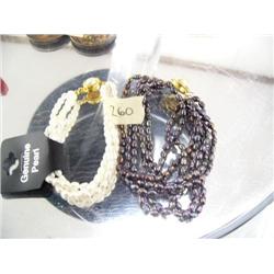 Lot of 2 multi-strand freshwater pearl bracelets- one white and other purplish (2)