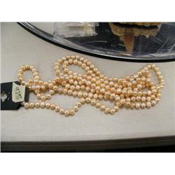 CHOICE on three 64" pearl necklaces (2)
