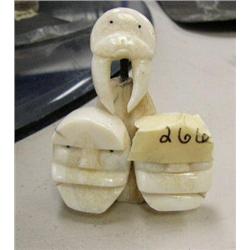 Ivory sculpture of walrus and 2 faces by Mark Seeganna (2)