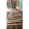 Image 8 : Large pile of round fence post stakes