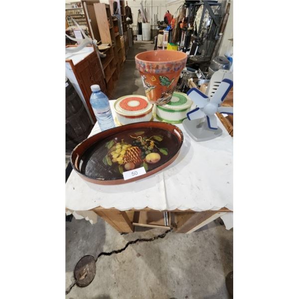 Fruit serving platter, lidded cannisters, flower