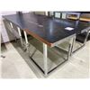 Image 1 : Two Large Black Top Shop Tables  both are 72w x30d   34tall & 28tall
