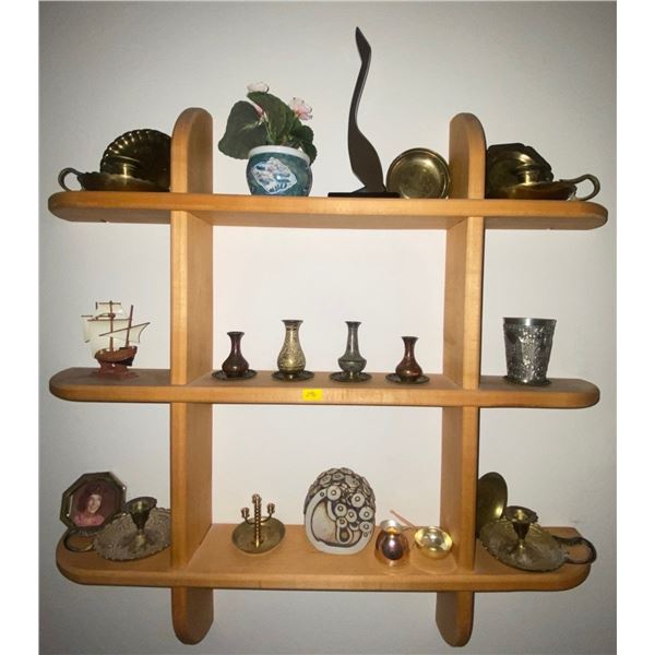 Wall Shelf Containing Various Trinkets From Around The World