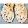 Image 2 : Child's beaded moccasins in display case