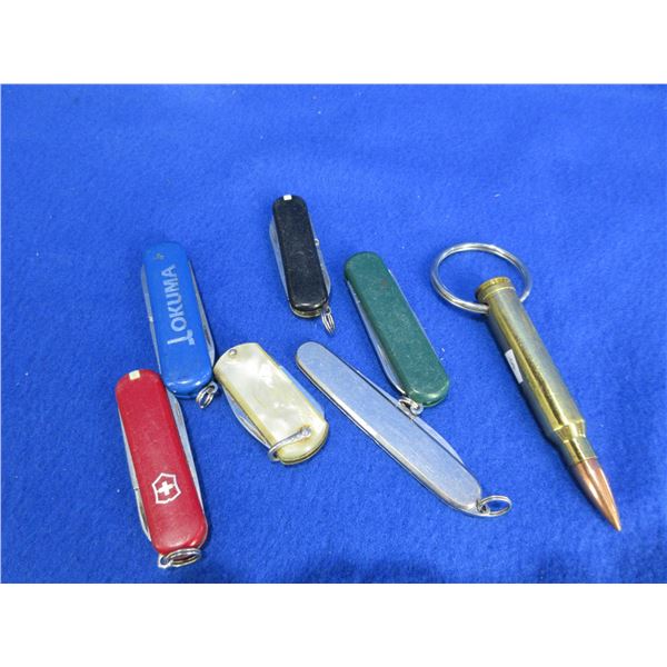 6 Key Chain Knives and 300 Win. Mag Brass Key Chain