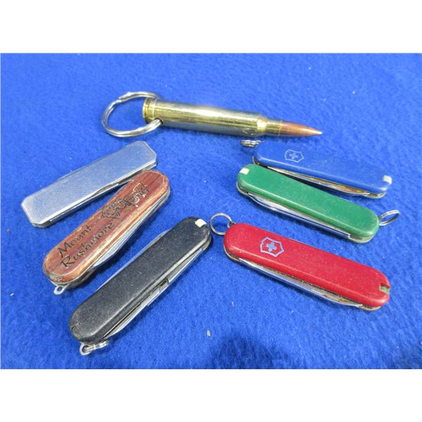 6 Key Chain Knives and 300 Win. Mag Brass Key Chain
