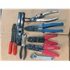 Image 1 : wire strippers, wrenches, ring spreader, etc.
