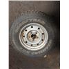 Image 1 : Goodyear Wrangler 245/75R16 tire on 5 bolt rim