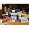 Image 1 : assorted spark plugs, thermostats, exhuast clamps, etc.