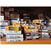 Image 2 : assorted spark plugs, thermostats, exhuast clamps, etc.