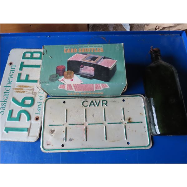 SK licence plate , card shuffler , antique bottle