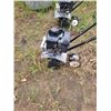 Image 1 : black mini rototiller needs carb kit
