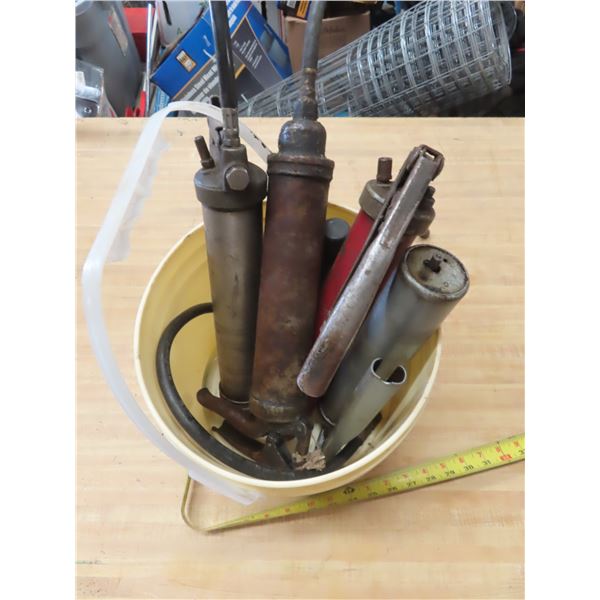 pail of grease guns