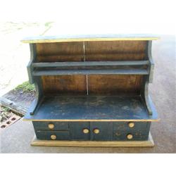 Small blue wood table top cabinet
