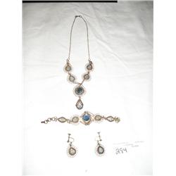 Necklace, bracelet, and earings.