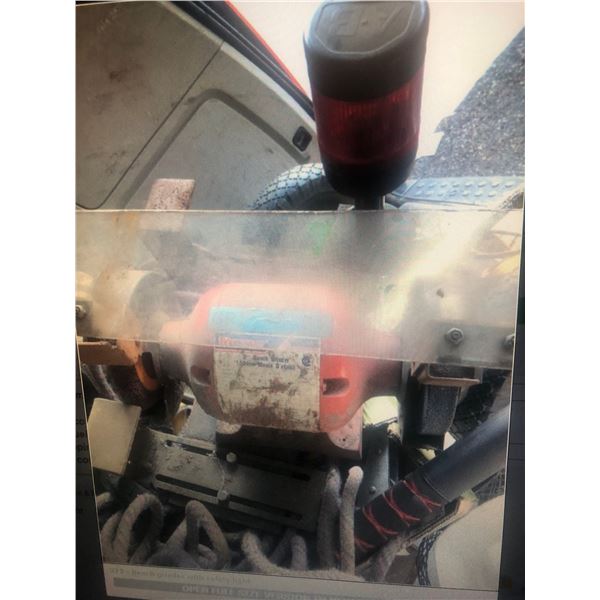 Bench grinder with safety light
