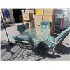 Image 1 : GLASS PATIO TABLE WITH 4 CHAIRS