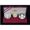 Image 1 : 1983-84 Olympic Dollar & Gold $10 Three-Piece Proof Set.