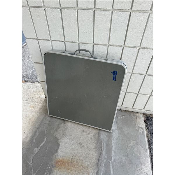 Broad stone folding table