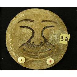 Whale bone disk relief carving of face with ivory and bead mouth adornments 6" (2)