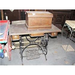 Domestic treadle sewing machine with walnut case ca. 1890