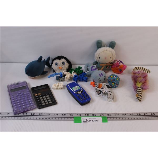 Penguin TY, (2) Calculators, Cat toys, Cap Gun, Misc.