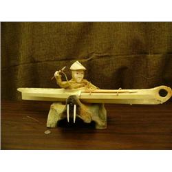 31" seal hide kayak with Aleut hunter, ivory hands and face, Aleut hunting hat, harpoon, and ice too