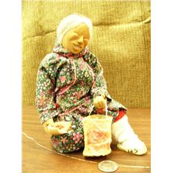 Eskimo doll 8" tall picking berries, wood face and hands, seal gut basket with berries, made by Penn