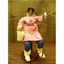 10" doll, carved wood face, seal hide basket with shells and seafood by Shelley Chamberlain, wearing