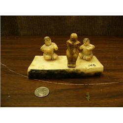3 ivory dancers carved from fossilized ivory 2" tall mounted on 5.5" piece of fossilized walrus ivor