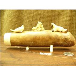 7.5" oosik with ivory tip mounted with 2" ivory man crawling and sneaking up on 1.5" long seal, circ