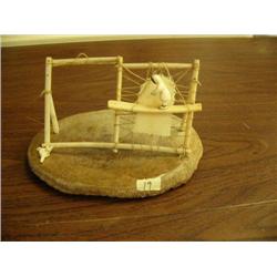 Ivory scene of man with drying seal skin circa 1960 (148)