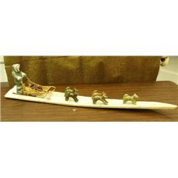 Outstanding soapstone, whalebone and wood Iditarod dog team. 50" long and 5 soapstone dogs with wood