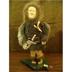 CHOICE on 2: sixteen inch whale bone and ivory doll with ivory hands, face, knife, tipped-arrows, an