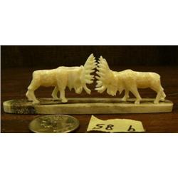 CHOICE on 3: Pair of 2" ivory bull moose mounted on whale bone base 4" long (2)