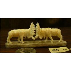 CHOICE on 3: Pair of 2" ivory bull moose mounted on whale bone base 4" long (2)