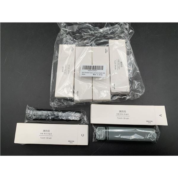 Lot of Travel Toothbrushes