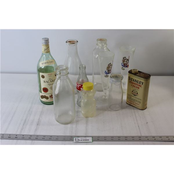 Assorted Glass Bottles, Wine Glasses, Furniture Cream