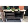 Image 2 : HALL TABLE, HUTCH WITH 2 DRAWERS AND GLASS SHELF AND ASSORTED FAUX PLANTS