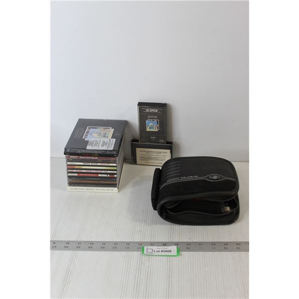 (12) Assorted CD's, (20) CD's In Fabric Case, (2) Cassette Tapes
